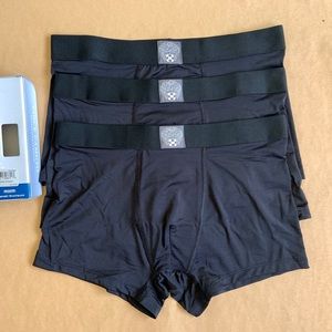 Vince Camuto black trunks medium